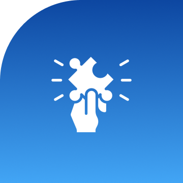 Hand holding puzzle piece on blue background.