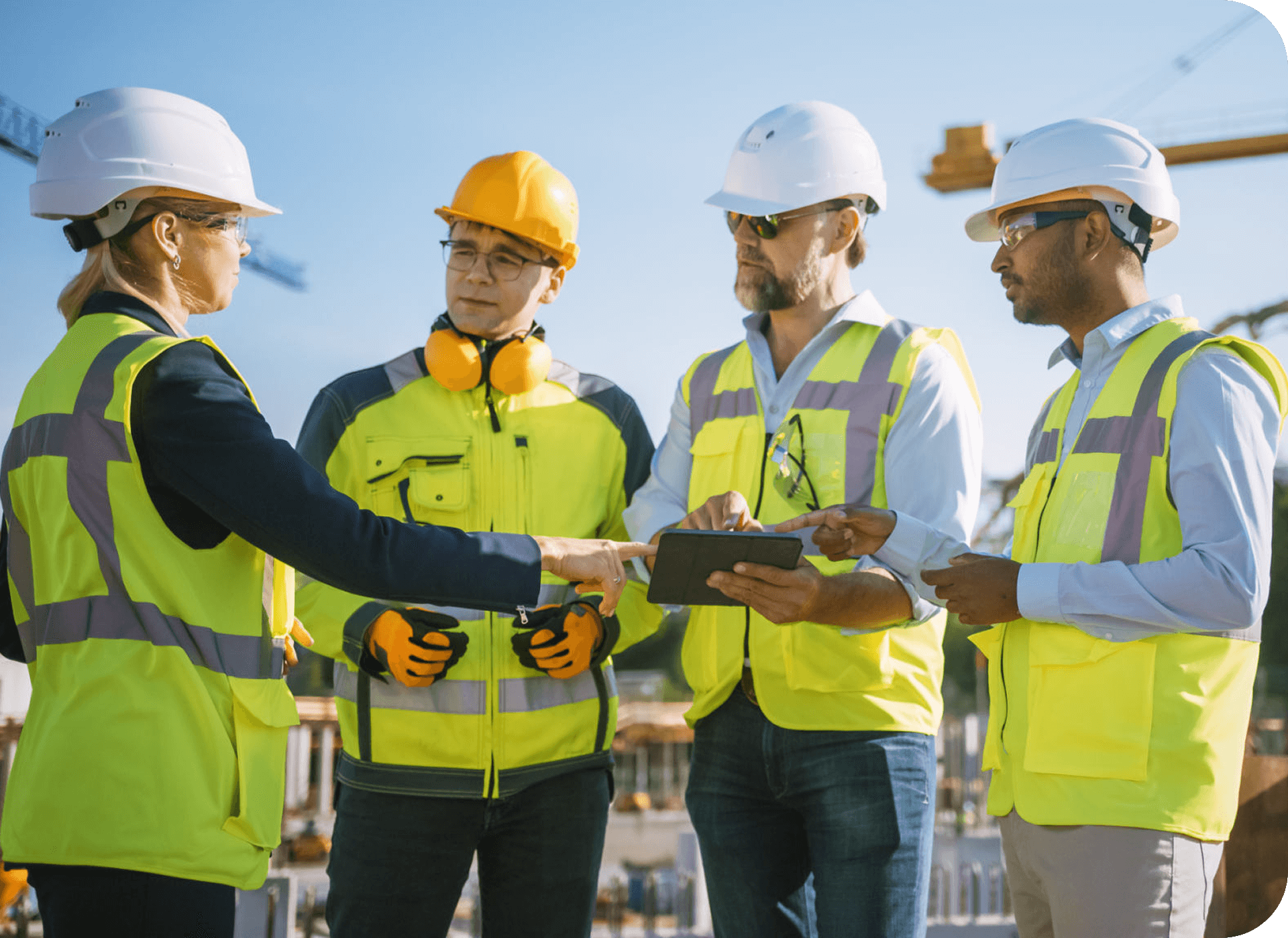 Construction team discussing plans on site.